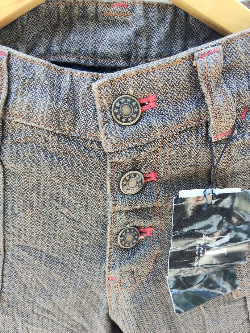 Rare Brown Flare Pants with Button Fly (Category: Other Bottoms) located in City of Isabela. Submitted by jasheverything (Listing ID 1461932745, Image 3). Description: - Brown flare pants with a unique textured weave. - Features a button-up front with distinctive star-embossed buttons. - Eye-catching red stitching details for a pop of color. - Stylish cuffed hems. - Ideal for creating a retro or casual outfit. Waist Fit 28 to 32 Excellent Conditi