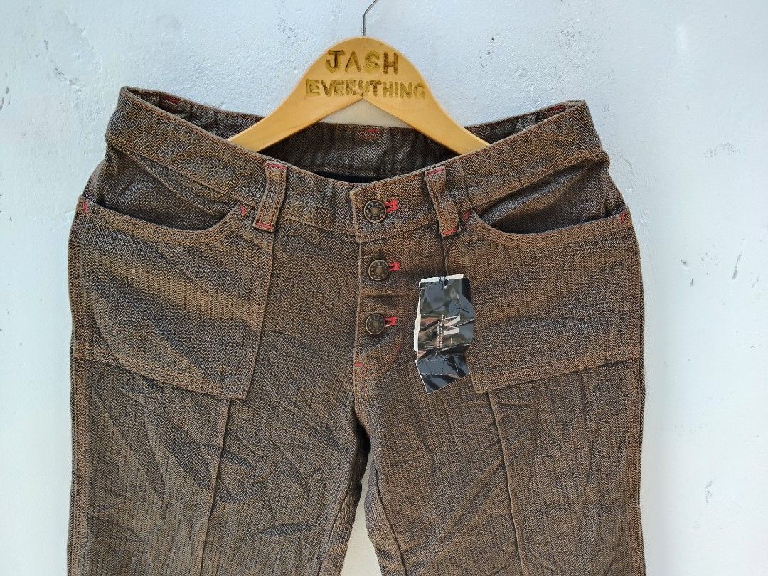 Rare Brown Flare Pants with Button Fly (Category: Other Bottoms) located in City of Isabela. Submitted by jasheverything (Listing ID 1461932745, Image 2). Description: - Brown flare pants with a unique textured weave. - Features a button-up front with distinctive star-embossed buttons. - Eye-catching red stitching details for a pop of color. - Stylish cuffed hems. - Ideal for creating a retro or casual outfit. Waist Fit 28 to 32 Excellent Conditi