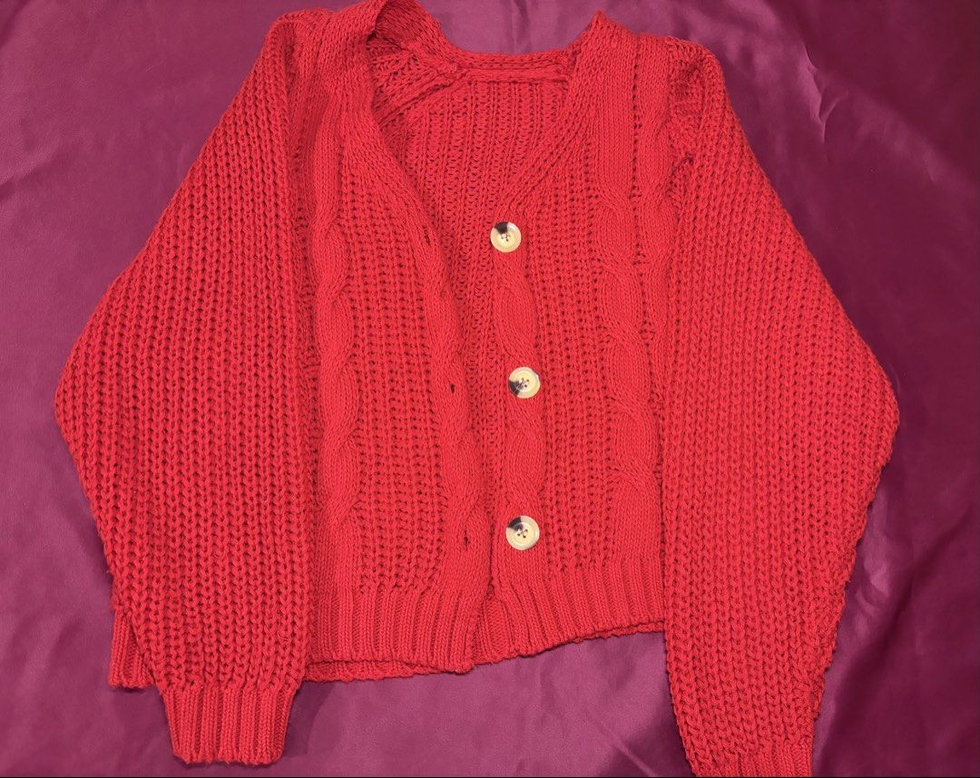 Red Cable Knit Button Up Cardigan / can fit s-m (Category: Coats, Jackets and Outerwear) located in Manila. Submitted by peachpreloved0 (Listing ID 1461941027, Image 1). Description: 🧣red knit cardigan ❤️ preloved, good condition 📌 RFS: decluttering / need funds for school expenses .
