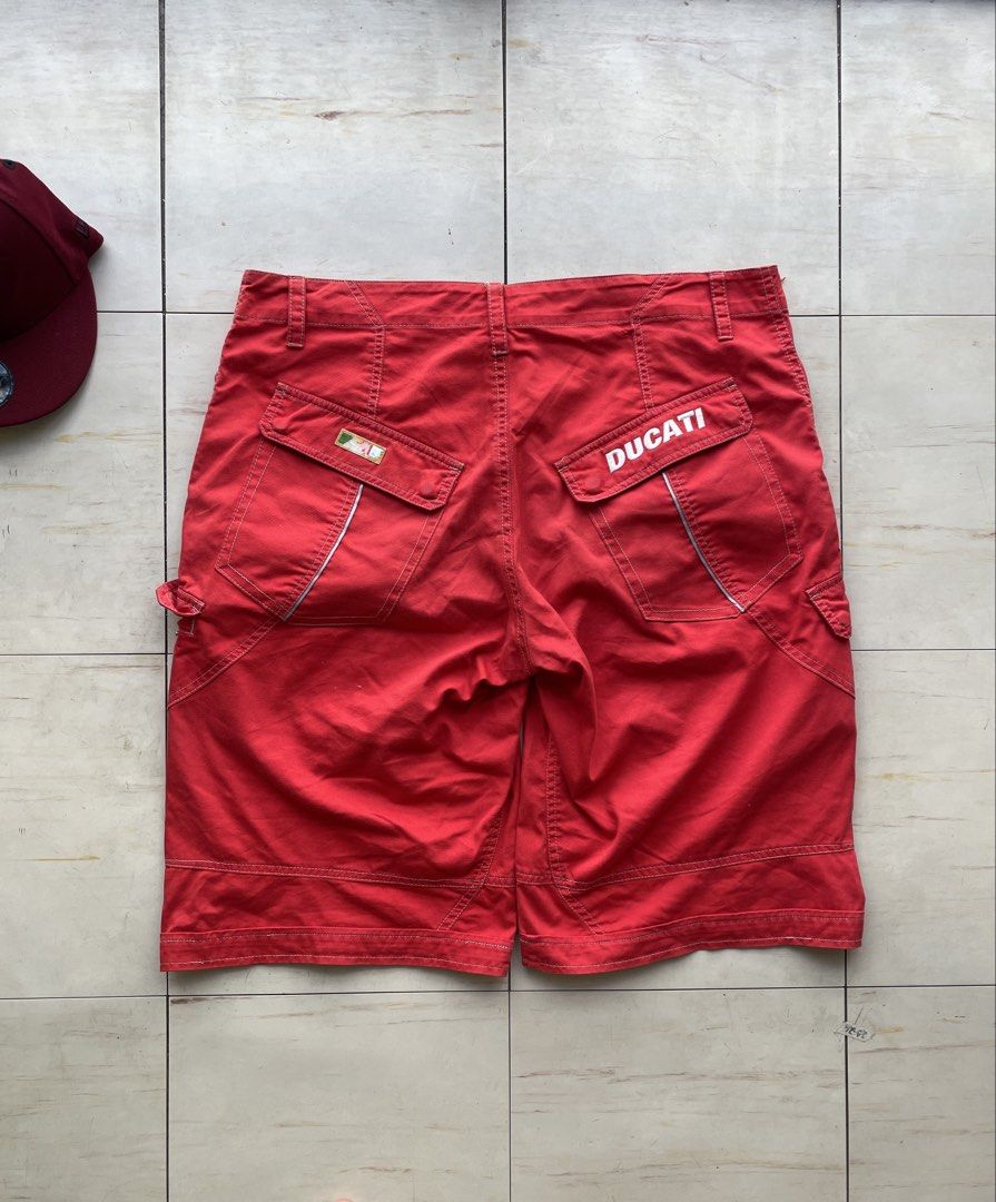 Red Ducati Puma Cargo Shorts (Category: Shorts) located in Manila. Submitted by cis_thrift143 (Listing ID 1461957861, Image 2). Description: - Red cargo shorts - Ducati branding on back pockets - Puma logo on front right leg - Button and zip closure - Multiple pockets for storage - Ideal for casual wear or active days Pm for details solid toh.