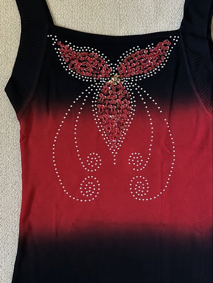 Red Graphic w/ rhinestone top (Category: Others Tops) located in Quezon City. Submitted by y2klar (Listing ID 1461957013, Image 2). Description: Red Graphic w/rhinestone top Size-Small-Medium L-24 10/10 Condition no flaws..