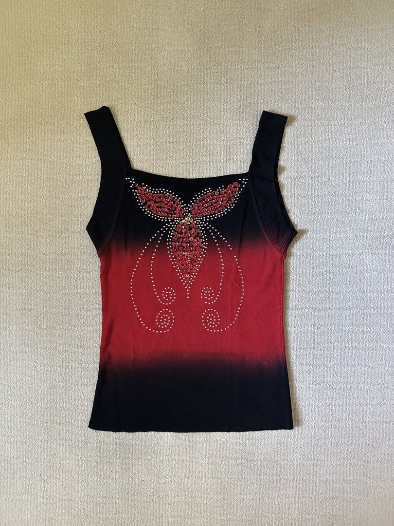 Red Graphic w/ rhinestone top (Category: Others Tops) located in Quezon City. Submitted by y2klar (Listing ID 1461957013, Image 1). Description: Red Graphic w/rhinestone top Size-Small-Medium L-24 10/10 Condition no flaws..