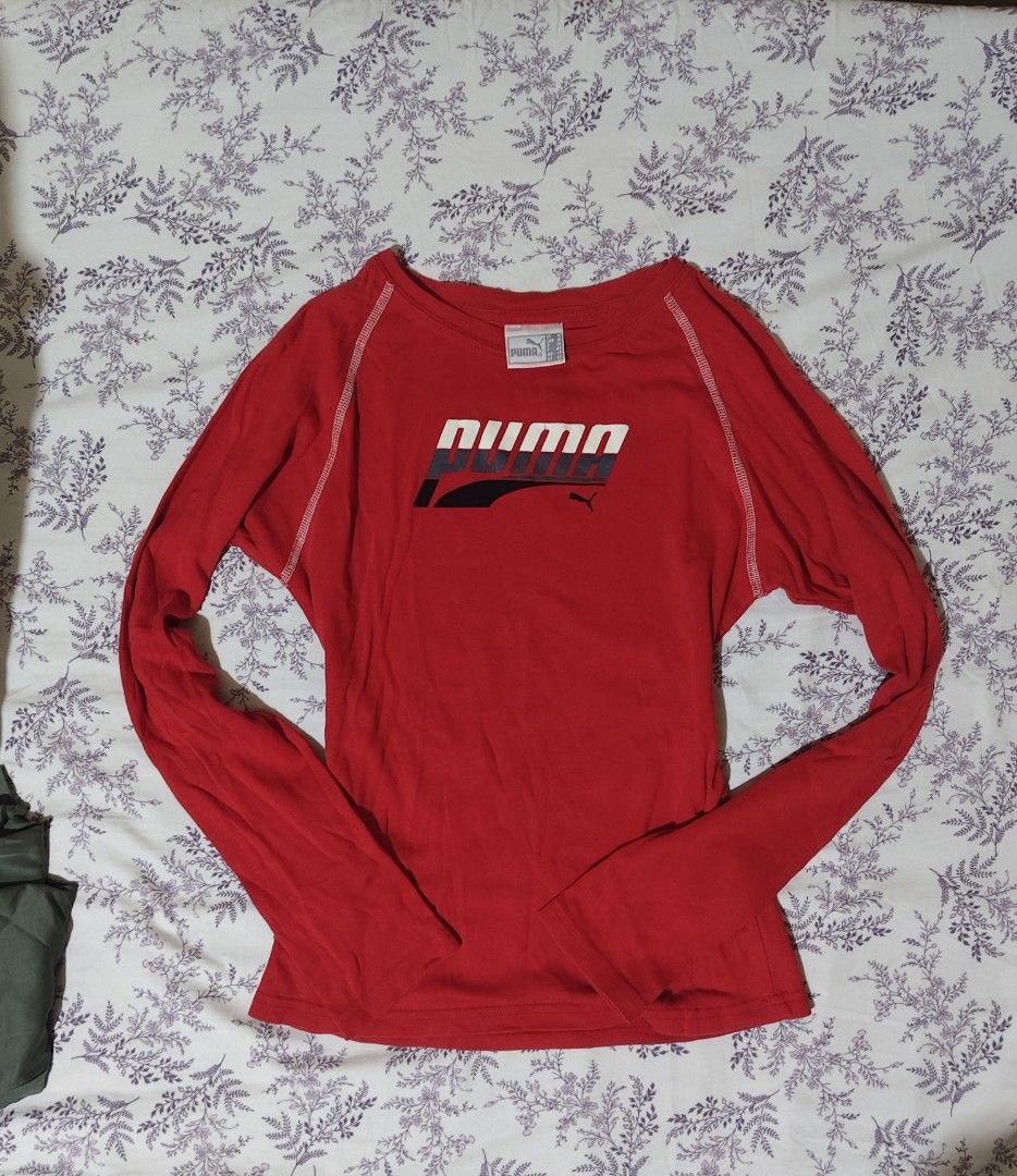 red long-sleeve Puma athletic shirt (Category: Tshirts & Polo Shirts ) located in Bulacan. Submitted by angel.decluttersx (Listing ID 1461979846, Image 1). Description: medium size on white tag orig cotton fabric material no cracks sa print no issue.