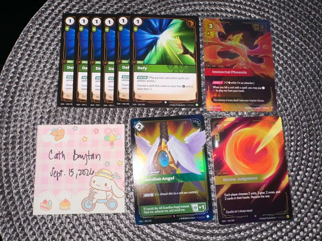 Riftbound TCG (Category: Raw Singles) located in Pasig City. Submitted by catwonieebuys (Listing ID 1461809054, Image 1). Description: FOR SALE WTS/LFB - slightly below collectr price - mop: gotyme - mod: lalamove, grab express, jnt - loc: rosario pasig - payment upon pickup if sdd defy - 200 each immortal phoenix - 420 guardian angel - 70 divine judgment - 330.