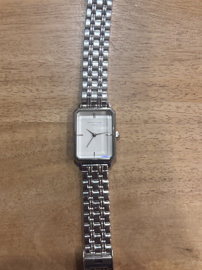 Rosefield Watch Silver Rectangle Face (Category: Women's Watches) located in Carmen. Submitted by t1torref (Listing ID 1461903408, Image 1). Description: - Rosefield silver watch - Rectangular face with a clean white dial - Metal link strap - Simple and classic design - Perfect for everyday wear or dressing up - Works well.