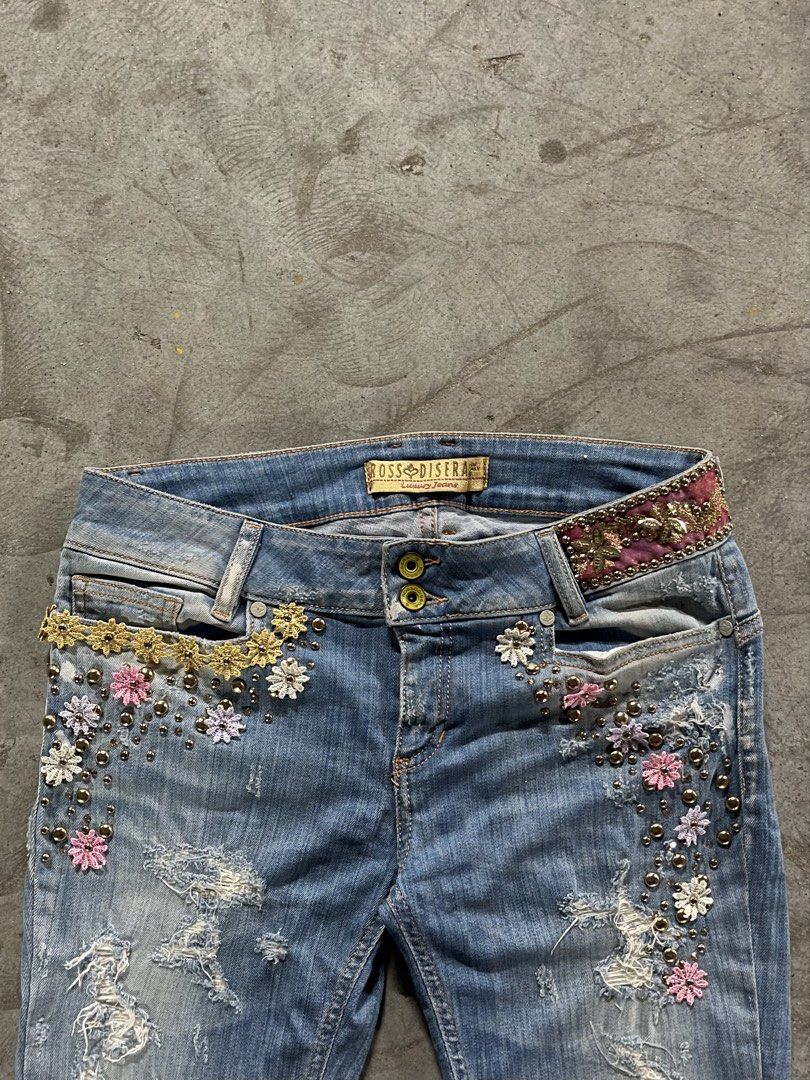 Ross Disera Embellished Distressed Denim Jeans (Category: Jeans) located in Mabalacat. Submitted by bettybey (Listing ID 1461830046, Image 1). Description: HEARING OFFERSSSS brand: Ross Disera lightly washed low rise jeans with floral embroidery, beaded gold embellishments, and subtle distressing. Hearring offersssss, dm for ww😚.