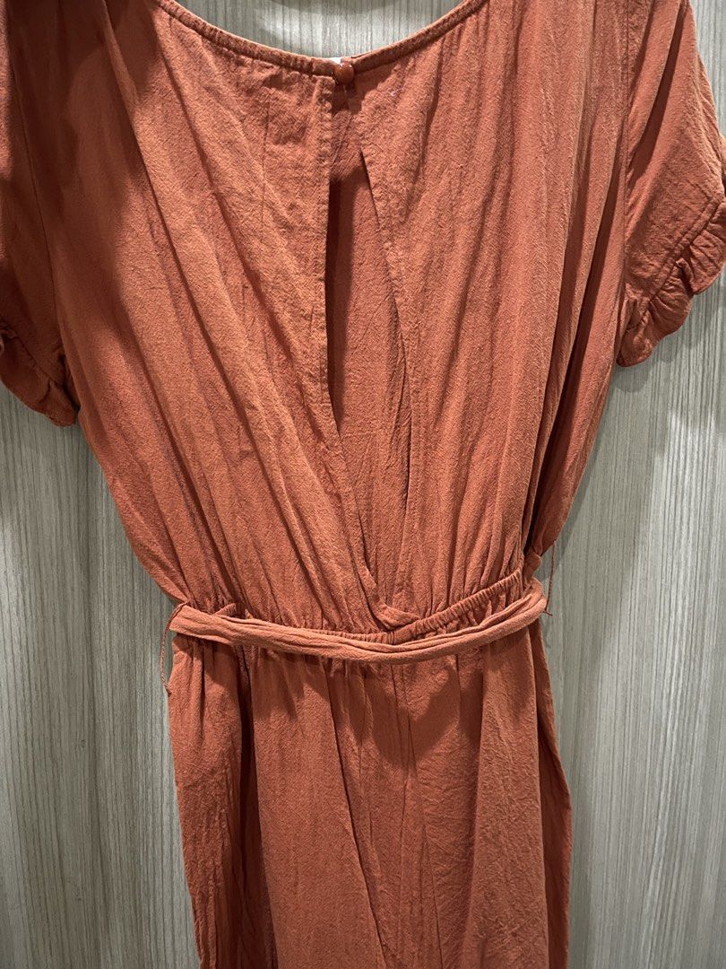 Rust colored Romper (Category: Rompers) located in Manila. Submitted by shiezzels (Listing ID 1461975298, Image 3). Description: Shein Romper Color- Rust Has a belt Open back Garter waist Medium on tag Can fit medium to semi-large .