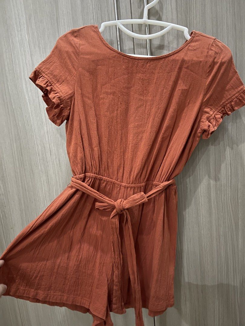 Rust colored Romper (Category: Rompers) located in Manila. Submitted by shiezzels (Listing ID 1461975298, Image 2). Description: Shein Romper Color- Rust Has a belt Open back Garter waist Medium on tag Can fit medium to semi-large .