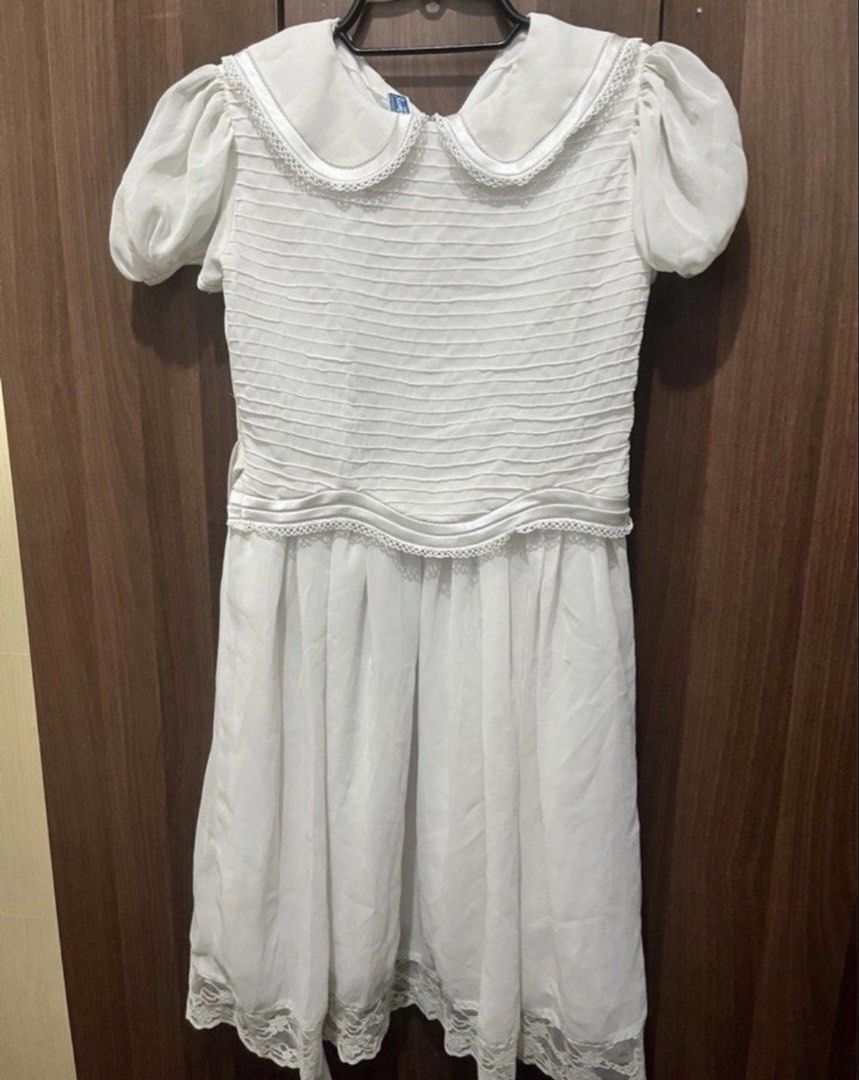 Rustanette White Communion dress (Category: Babies & Kids Fashion) located in Rizal. Submitted by cassappl (Listing ID 1461801291, Image 1). Description: - Adorable white dress - Short puff sleeves - Cute Peter Pan collar with delicate lace trim - Textured, ruched bodice for a flattering fit - Flowy skirt with elegant lace detailing at the hem - Ideal for parties, special occasions, or dressy events - Effortless to style for any occasion.