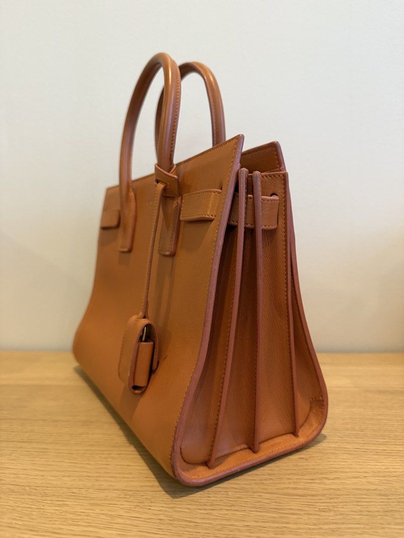 Saint Laurent Sac de Jour Nano (Category: Cross-body Bags) located in Makati City. Submitted by shop.millennialcloset (Listing ID 1461802340, Image 2). Description: - Authentic Saint Laurent Sac de Jour Nano bag - Smooth, high-quality leather - Iconic and structured design - Compact nano size, perfect for essentials - Features signature Saint Laurent detailing - Minor marks, as shown in photos - can be cleaned - Meetups available in Greenbelt and