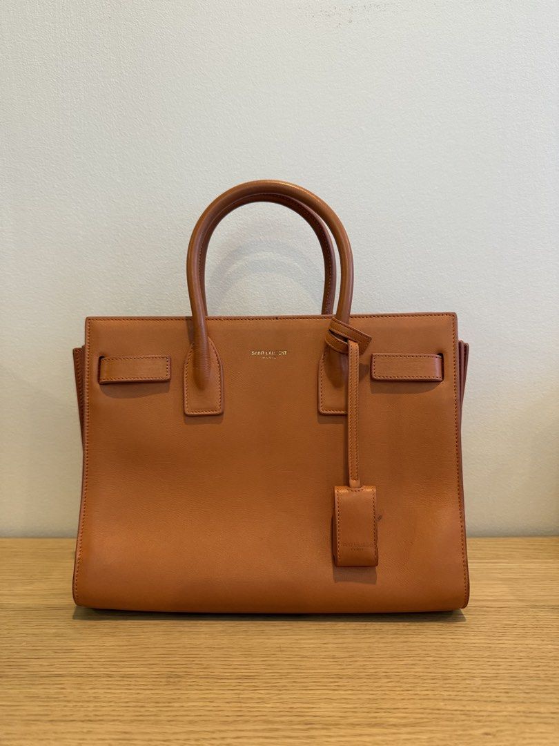 Saint Laurent Sac de Jour Nano (Category: Cross-body Bags) located in Makati City. Submitted by shop.millennialcloset (Listing ID 1461802340, Image 1). Description: - Authentic Saint Laurent Sac de Jour Nano bag - Smooth, high-quality leather - Iconic and structured design - Compact nano size, perfect for essentials - Features signature Saint Laurent detailing - Minor marks, as shown in photos - can be cleaned - Meetups available in Greenbelt and