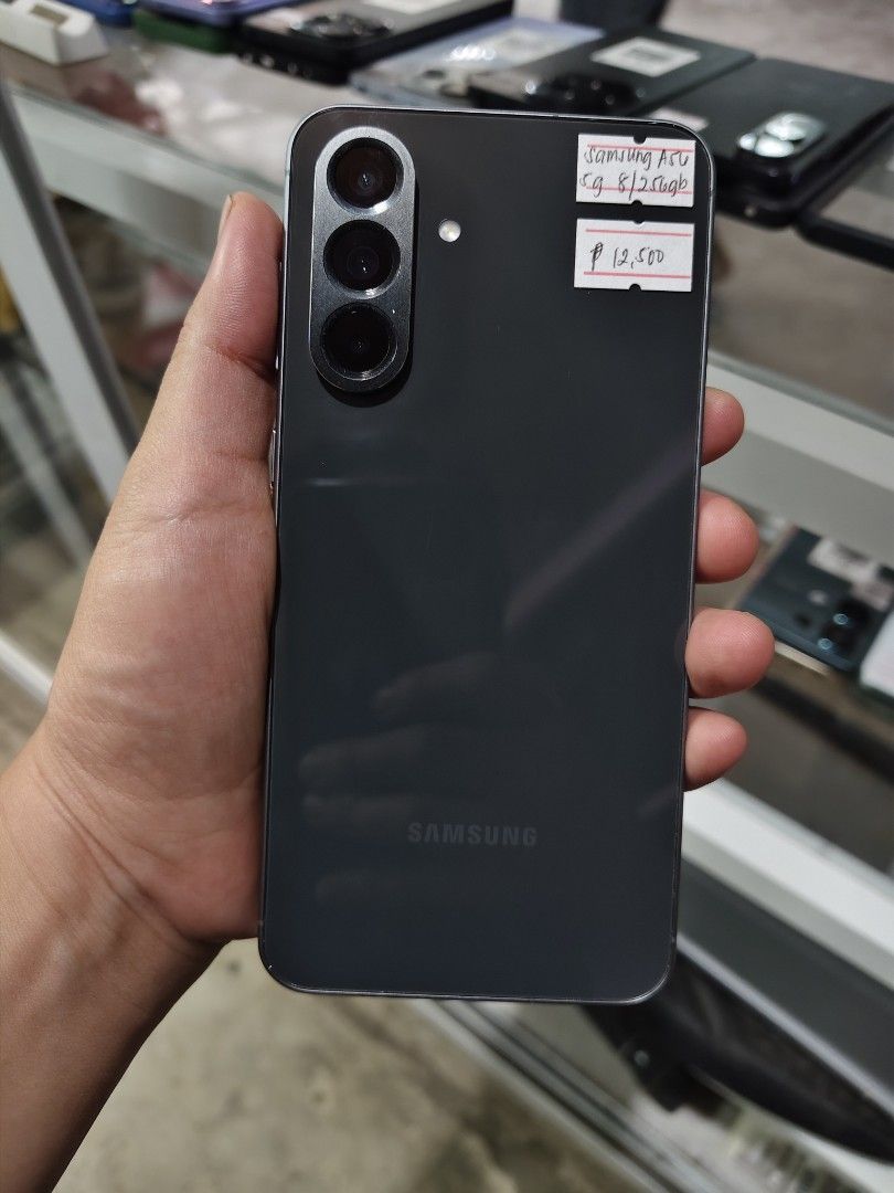 SAMSUNG A56 5G (Category: Early Generation Mobile Phones) located in Manila. Submitted by atejo_store (Listing ID 1461928637, Image 1). Description: Samsung Galaxy A56 5G 8GB/256GB Specs : • 6.7 FHD+ SUPER AMOLED DISPLAY • 120Hz REFRESH RATE • EXYNOS 1580 (4nm) • 8GB/256GB Internal Storage (No microSD) • 50MP wide (OIS) • 12MP ultrawide • 5MP macro • 5000mAh Battery • 45W Fast Charging • IP67 Dust and Water resistance • Gorilla Glass Victus+ (fro