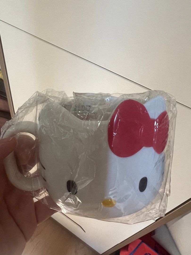 Sanrio Hello Kitty Mug Made in Japan Co. (Category: Coffee & Tea Tableware) located in San Juan City. Submitted by iambernie (Listing ID 1461901522, Image 1). Description: - plastic hello kitty mug from Sanrio land in Tokyo, never used - Classic white with iconic red bow detail - A must-have for Kitty collectors - Also great for everyday use - Exclusive: Made in China for Japan market only - Comes with original packaging.
