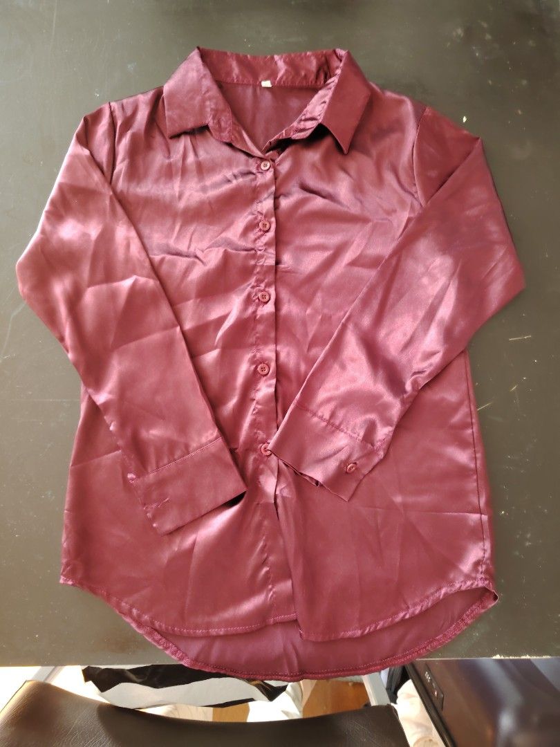 Satin Button-Up Shirt (Category: Coats, Jackets and Outerwear) located in Manila. Submitted by vastshark.ebbab2 (Listing ID 1461927496, Image 2). Description: - Lightweight satin fabric with a beautiful sheen - Classic button-up design with a collar - Long sleeves with button cuffs - Effortlessly dress up or down - Pairs well with jeans or trousers.