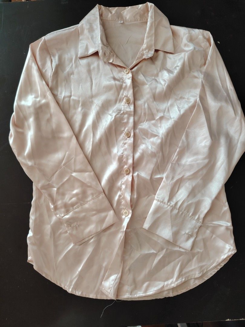 Satin Button-Up Shirt (Category: Coats, Jackets and Outerwear) located in Manila. Submitted by vastshark.ebbab2 (Listing ID 1461927496, Image 1). Description: - Lightweight satin fabric with a beautiful sheen - Classic button-up design with a collar - Long sleeves with button cuffs - Effortlessly dress up or down - Pairs well with jeans or trousers.