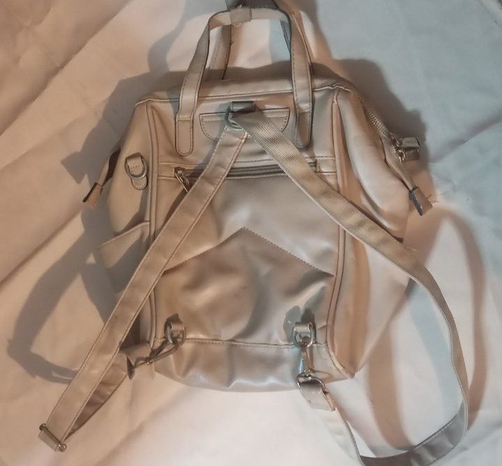 Secosana Beige Convertible Backpack/Handbag Preloved (Category: Backpacks) located in Manila. Submitted by hi.yunichi (Listing ID 1462009412, Image 3). Description: - Versatile design: can be worn as a backpack or carried as a handbag. - Chic neutral beige color. - Stylish quilted detail on the front pocket. - Multiple zippered compartments for excellent organization. - Adjustable straps for a comfortable fit. - Ideal for everyday use..