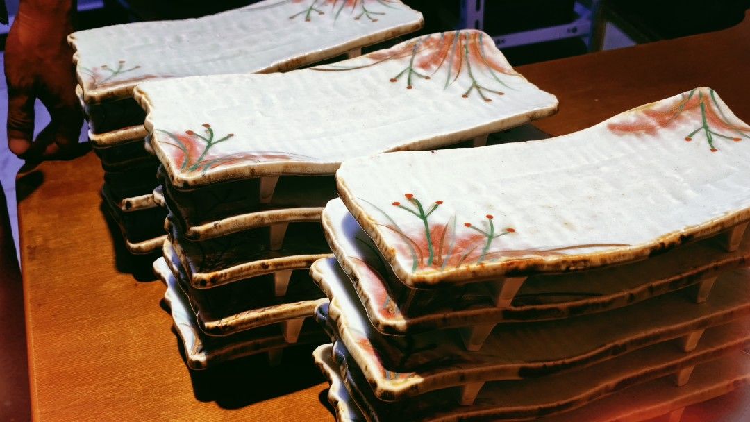 Set of Rectangular Ceramic Plates with Floral Design (Category: Dinnerware & Cutlery) located in Bulacan. Submitted by babz30261 (Listing ID 1461989317, Image 2). Description: - Set of unique rectangular ceramic plates - White base with delicate red and green floral design - Rustic, glazed wavy edges - Ideal for serving appetizers, sushi, or small dishes.
