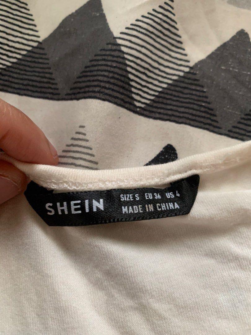 SHEIN White Twisted Front Cut-Out Top Size S (Category: Sleeveless) located in Caloocan City. Submitted by diannecarl32964 (Listing ID 1461824392, Image 1). Description: - SHEIN white top - Size S (EU 36, US 4) - Twisted knot detail with front cut-out - Short sleeves - Small stain on front (please check photos) - Made in China.