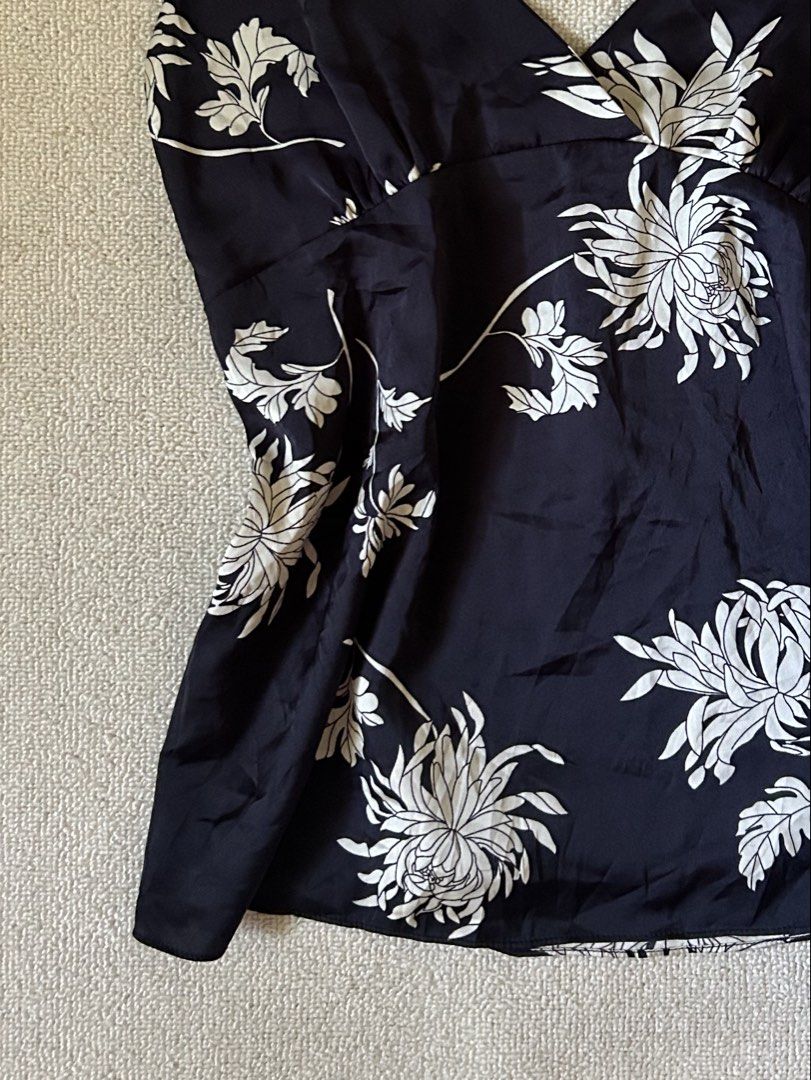 Silk graphic top (Category: Others Tops) located in Quezon City. Submitted by y2klar (Listing ID 1461959388, Image 3). Description: Black Silk Cami top Size-Small-Medium 10/10 Condition no flaws..