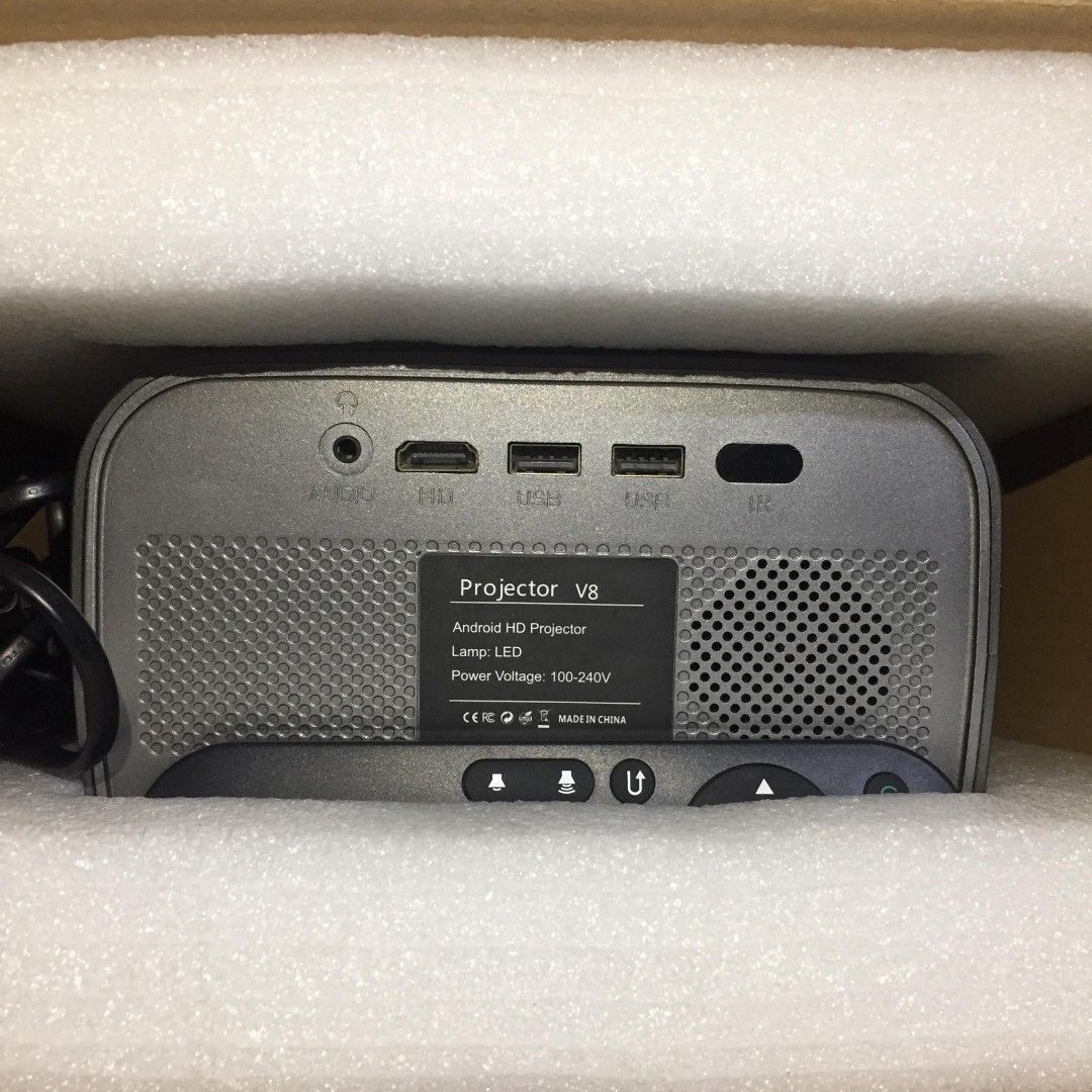 Smart Projector V8 (Category: Projectors) located in Quezon City. Submitted by kyla.lago (Listing ID 1461956365, Image 2). Description: Smart Projector V8 • 200 ANSI Lumens • Adjustable Screen Size • Android HD Projector • LED Lamp • HDMI / USB / AV / Audio • 100–240V Condition: Used but working properly. Issue: Sira na po yung adjustable handle/stand sa gilid na pang-adjust para ma-flip yung projector. • Used for YouTube and HDMI connected to la