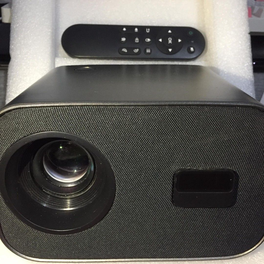 Smart Projector V8 (Category: Projectors) located in Quezon City. Submitted by kyla.lago (Listing ID 1461956365, Image 3). Description: Smart Projector V8 • 200 ANSI Lumens • Adjustable Screen Size • Android HD Projector • LED Lamp • HDMI / USB / AV / Audio • 100–240V Condition: Used but working properly. Issue: Sira na po yung adjustable handle/stand sa gilid na pang-adjust para ma-flip yung projector. • Used for YouTube and HDMI connected to la