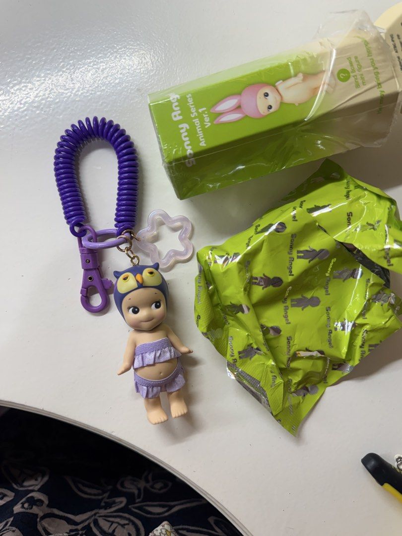 Sonny Angel Owl Keychain (Category: Designer & Blind Box Toys) located in Talisay. Submitted by omgitsjoan60277 (Listing ID 1461934297, Image 3). Description: - Cute Sonny Angel keychain - Owl design from Animal Series Ver.1 - Comes with purple coil strap and star charm - Original packaging (box and foil wrapper) included - Great for decorating bags or keys Loc: Negros Occidental .