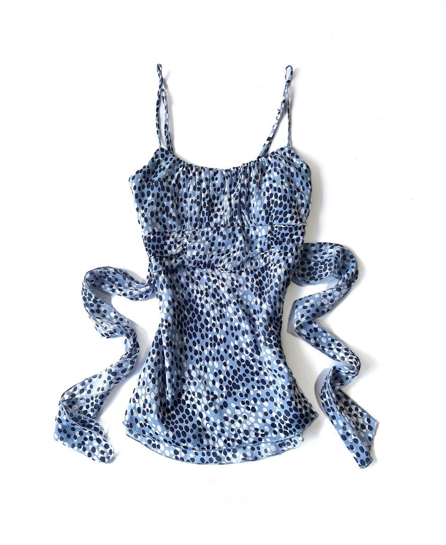 Speechless y2k Blue Dotted Camisole Top with Tie (Category: Sleeveless) located in Batac City. Submitted by doniagel (Listing ID 1461801172, Image 1). Description: - Adorable blue camisole top with a charming dotted pattern. - Features adjustable straps for a perfect fit. - Flattering ruched bust detail. - Comes with a matching tie belt to cinch your waist. - Made from lightweight, flowy fabric. - Versatile for layering or wearing solo. adjustabl
