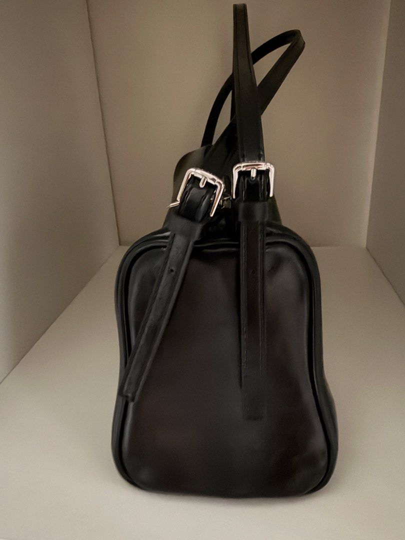STAND OIL Black Leather Shoulder Bag (Category: Shoulder Bags) located in Makati City. Submitted by andy0019 (Listing ID 1461803131, Image 3). Description: doesnt come with the charm barely used with wallet and dust bag.