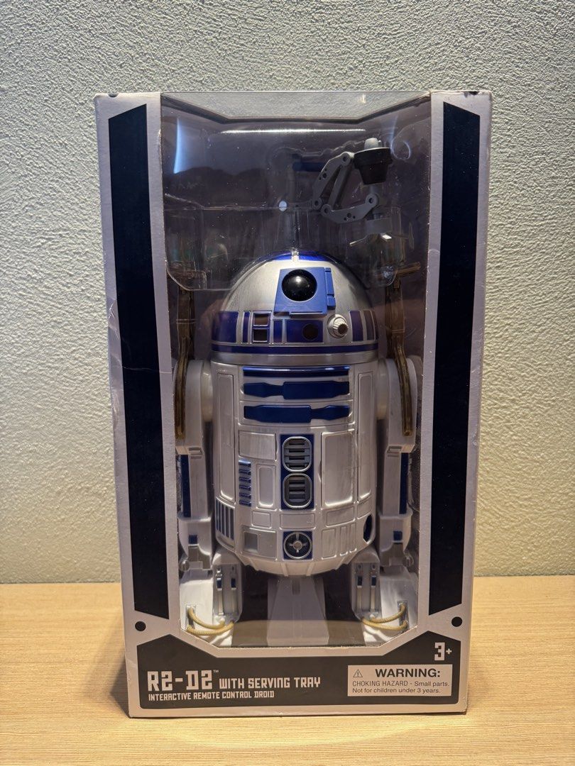 Star Wars R2-D2 Interactive Remote Control Droid with Serving Tray (Category: Remote Control Toys) located in Manila. Submitted by kuroshirooreo (Listing ID 1461870278, Image 1). Description: - Interactive R2-D2 droid with remote control - Features a detachable serving tray - Dome activates accessories - Includes light and sound effects - Droid Depot from Disneyland USA.