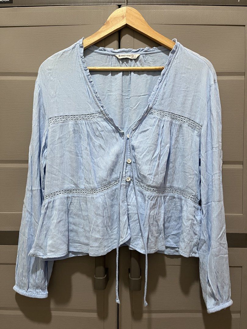 Stradivarious Light Blue Textured Long Sleeve Blouse Size L (Category: Longsleeves) located in Koronadal. Submitted by declutterprelovednitine_ey (Listing ID 1461810607, Image 1). Description: - Light blue textured blouse from Bershka - Long sleeves with delicate lace detail - Button-up front with adjustable tie at the hem - Minor flaw: small hole on the left sleeve near the cuff (refer to the last photo for exact location).