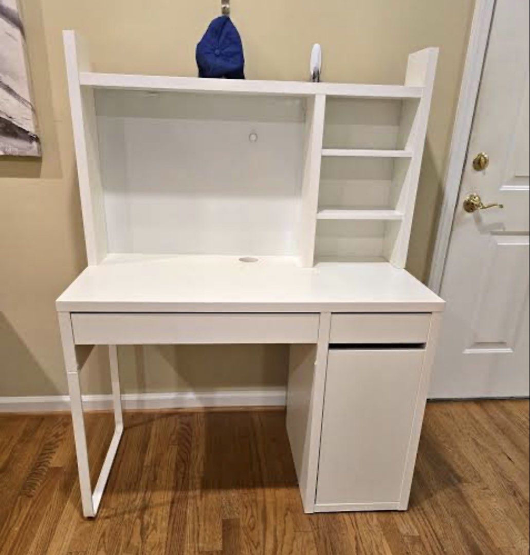 Study table (Category: Tables & Sets) located in Singapore. Submitted by shoppitt (Listing ID 1461871697, Image 1). Description: - White desk with hutch - Built-in shelves - One drawer - Cabinet space - Modern, clean lines design - Ample storage and workspace - Ideal for study room or bedroom.