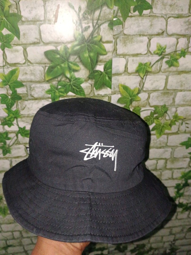 Stussy Black Bucket Hat (Category: Caps & Hats) located in Carcar. Submitted by rolandobac92675 (Listing ID 1461819889, Image 3). Description: - Classic black Stussy bucket hat - Simple and versatile design - Embroidered Stussy logo on the front - Small Stussy tag on the side - One size fits most - Ideal for sunny days and streetwear outfits.