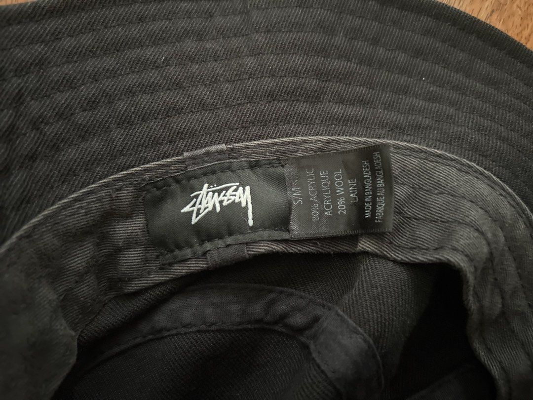 Stussy Bucket Hat Black S/M (Category: Caps & Hats) located in Pulilan. Submitted by koty187 (Listing ID 1461854678, Image 2). Description: - Classic Stussy bucket hat in black - Material: 80% Acrylic, 20% Wool - Size: S/M - Perfect for everyday wear and keeping the sun out of your eyes - Stylish and versatile accessory - Made in Bangladesh.