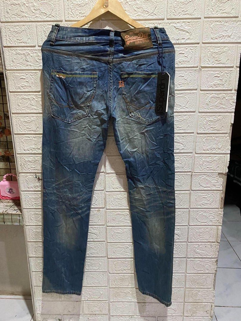 Superdry Vintage Blue Denim Jeans (Category: Jeans) located in Rizal. Submitted by tiangarcia02 (Listing ID 1461934483, Image 2). Description: - Superdry blue denim jeans - Vintage wash with distressed detailing - Straight leg fit - Features Superdry logo printed on the side - Ideal for casual wear.