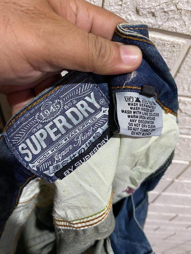 Superdry Vintage Blue Denim Jeans (Category: Jeans) located in Rizal. Submitted by tiangarcia02 (Listing ID 1461934483, Image 3). Description: - Superdry blue denim jeans - Vintage wash with distressed detailing - Straight leg fit - Features Superdry logo printed on the side - Ideal for casual wear.