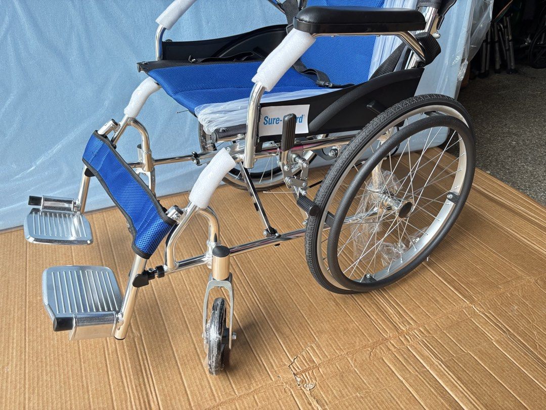 Sure-Guard Lightweight Folding Wheelchair Blue (Category: Wheelchairs) located in Manila. Submitted by rosel2001 (Listing ID 1461831175, Image 2). Description: - Lightweight and foldable for easy transport and storage - Padded seat and backrest for maximum comfort - Includes armrests and footrests - Equipped with a seatbelt for enhanced safety - Perfect mobility assistance solution - Ready for a new home.