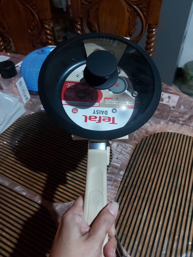 Tefal Daisy Titanium Non-Stick Frying Pan 20cm (Category: Cookware & Accessories) located in Manila. Submitted by veelafiera (Listing ID 1457819151, Image 3). Description: - Tefal Daisy Frying Pan - 20cm size - Durable Titanium Non-Stick Coating - Advanced Induction Base - suitable for all stovetops (gas, electric, ceramic, induction) - Perfect for everyday cooking - Comes in original packaging - with generic (not tefal brand) cover.