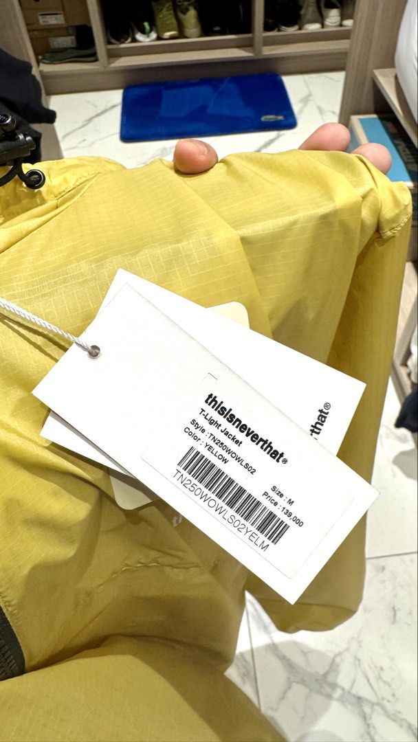 thisisneverthat T-Light Jacket Yellow Size M (Category: Coats, Jackets and Outerwear) located in Quezon City. Submitted by helloimcharles (Listing ID 1462027433, Image 3). Description: - Brand: thisisneverthat - Color: Yellow - Style: T-Light Jacket - Features: Lightweight, packable, full zip closure, hood, two front zip pockets - Usage: Ideal for layering or as a windbreaker - Condition: Brand new with original tags attached.