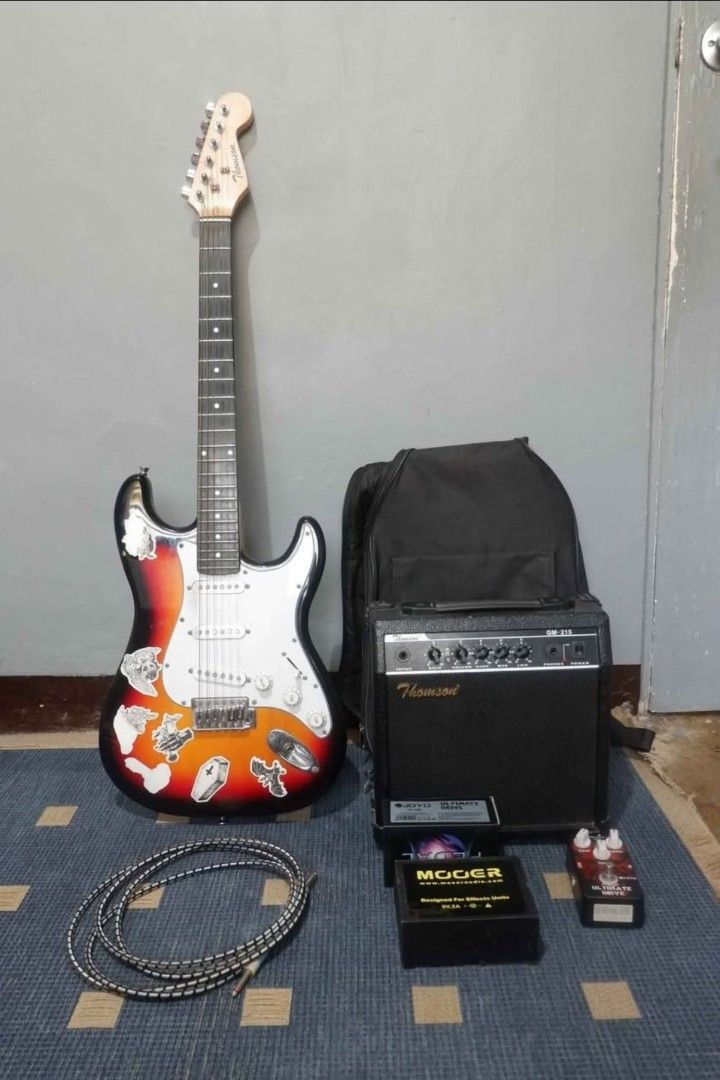 Thomson Sunburst Stratocaster Bundle (Amplifier, Overdrive Pedal, etc.) (Category: Musical Instruments) located in Manila. Submitted by kobsdr (Listing ID 1461870384, Image 1). Description: Thomson Sunburst Stratocaster Electric Guitar Bundle 100% Working Inclusions: Thomson Amplifier Gig Bag JOYO Ultimate Drive Pedal Pedal Power Supply Cable RFS: College Funds Issue: Signs of usage.