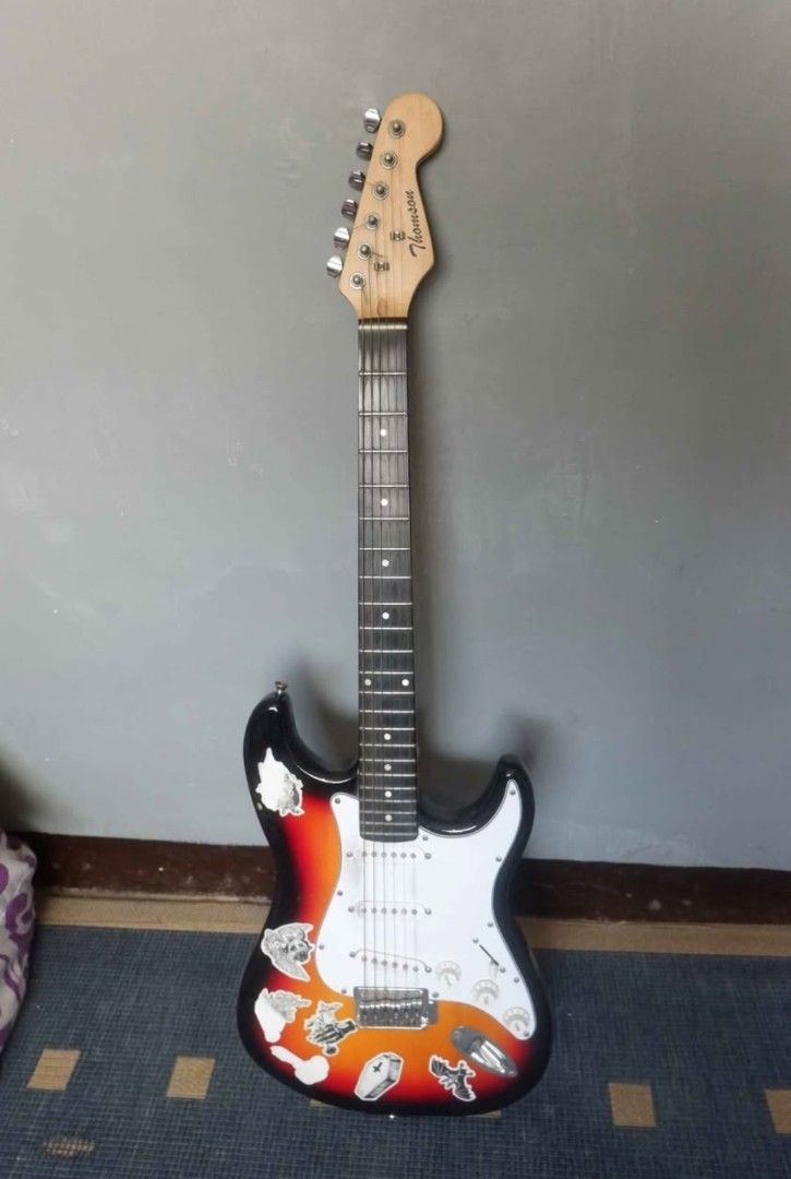 Thomson Sunburst Stratocaster Bundle (Amplifier, Overdrive Pedal, etc.) (Category: Musical Instruments) located in Manila. Submitted by kobsdr (Listing ID 1461870384, Image 2). Description: Thomson Sunburst Stratocaster Electric Guitar Bundle 100% Working Inclusions: Thomson Amplifier Gig Bag JOYO Ultimate Drive Pedal Pedal Power Supply Cable RFS: College Funds Issue: Signs of usage.