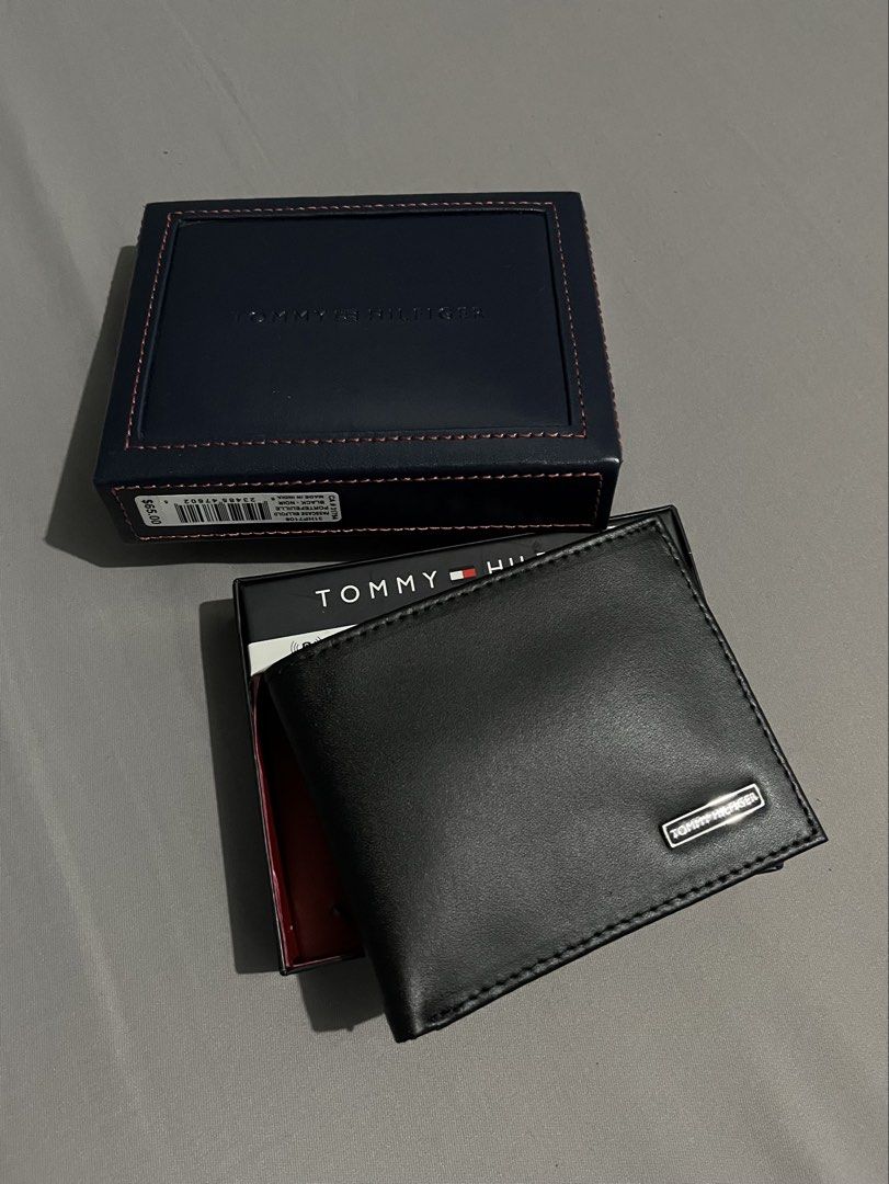 Tommy Hilfiger Black Leather Bifold Wallet with Box (Category: Wallets & Card Holders) located in Taguig. Submitted by csthejustin (Listing ID 1461920962, Image 2). Description: - Authentic with tag - Original box (still stringed/attached) - Cash compartment - 2 receipt pockets - 6 card slots - ID card window - RFID protection - Slim/Compact Pm for SURE buyers only, please. .