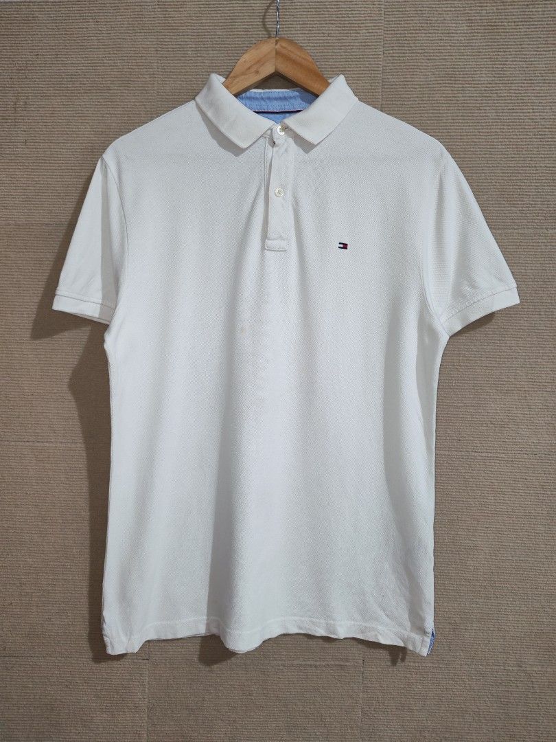 Tommy Hilfiger White Polo Shirt (Category: Tshirts & Polo Shirts ) located in Iligan City. Submitted by wantwears14 (Listing ID 1461866064, Image 1). Description: Guaranteed Authenticity Needs wash only 9.8/10 color rate Favorite polo Very Presentable It can fit Medium sizes body frame.