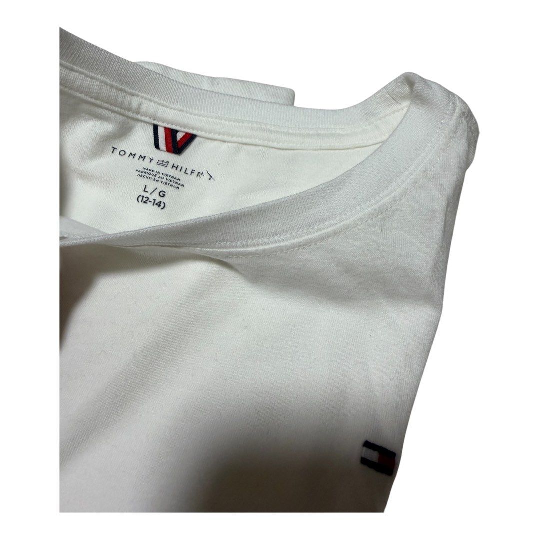 Tommy Hilfiger white shirt (Category: Babies & Kids Fashion) located in Lipa City. Submitted by lifestyled (Listing ID 1461852880, Image 2). Description: Tommy Hilfiger white shirts Size L (12-14) Aa-16” L- 21.5” Color rate 7/10 Sold as set 💯 Authentic.