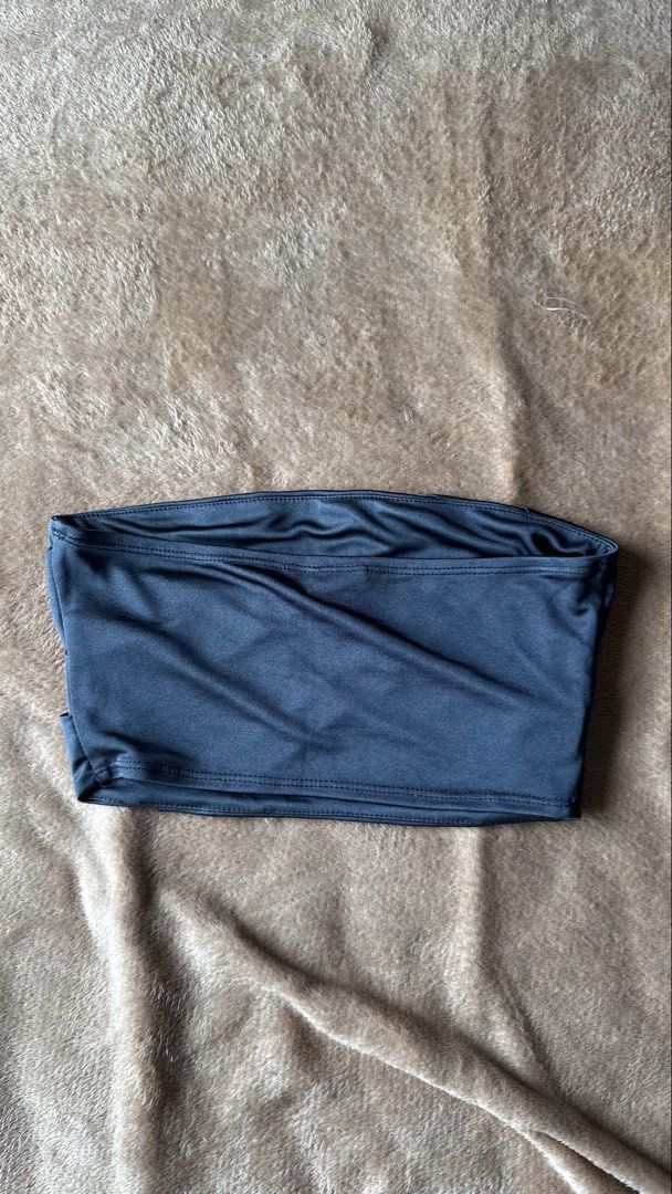 Topshop Black Bandeau Top (Category: Sleeveless) located in Mandaluyong City. Submitted by yv.stuff (Listing ID 1461833842, Image 3). Description: - Brand: Topshop - Style: Black bandeau top - Features: Unique criss-cross strap detail on the front - Material: Stretchy for comfort - Versatility: Great for layering or wearing on its own.