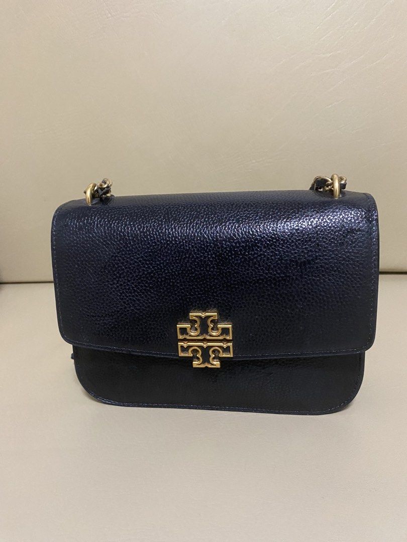 Tory Burch Black Leather Chain Shoulder Bag (Category: Luxury Bags & Wallets) located in Manila. Submitted by aikara683 (Listing ID 1461965253, Image 1). Description: - Authentic Tory Burch black leather shoulder bag - Features iconic gold logo hardware - Elegant chain strap with leather detailing - Spacious main compartment - Interior zip pocket for essentials - Versatile style, ideal for day or evening wear.