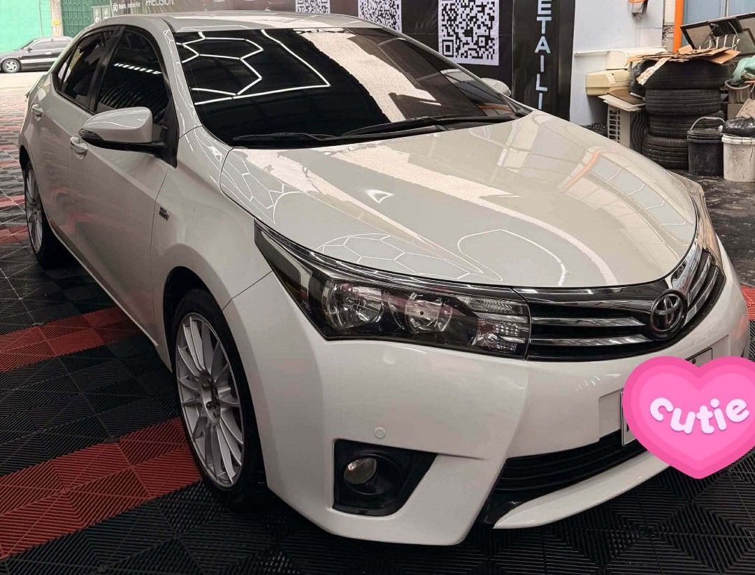 Toyota Corolla Altis 1.6 (A) (Category: Used Cars) located in Cavite. Submitted by karlmartianoliva01 (Listing ID 1461863465, Image 2). Description: Toyota altis 1.6 V 2017 model Automatic transmission Complete orig papers/docs 87k orig mileage Registered until june 2027 Pearl white Ice cold aircon Intact interiors Thick tires Newly pms Sept./14/2026 (change oil and filter) Tire 225/45/R18, (2024 production date) Advanti racing wheel Front and re