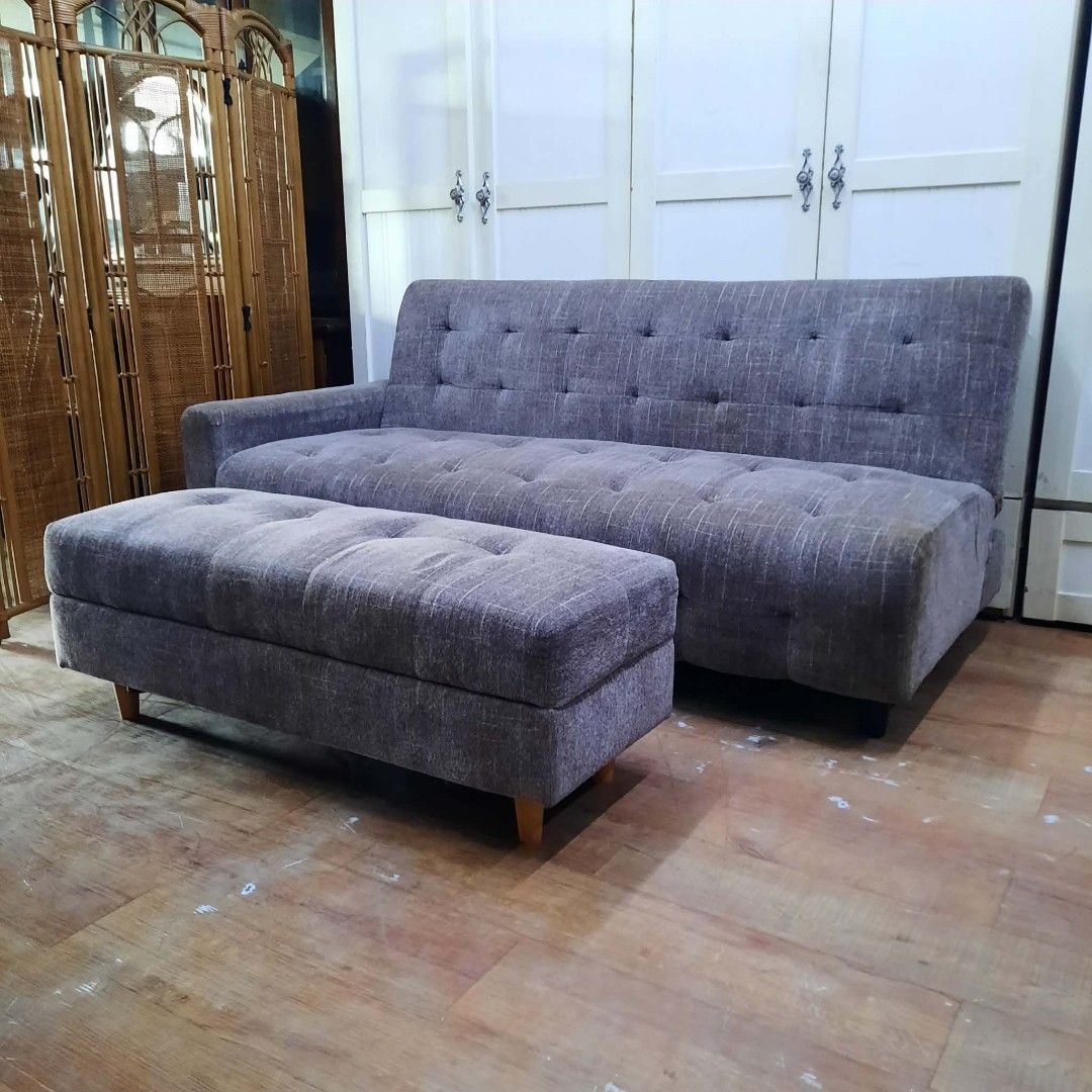 Tufted Sofa Bed with Ottoman - Grey Fabric (Category: Sofas) located in Manila. Submitted by ivan_furnitures421 (Listing ID 1461897857, Image 2). Description: - Grey fabric sofa bed - Tufted design on cushions and backrest - Includes matching ottoman (footrest or extra seating) - Converts into a bed for guests - Ideal for small spaces - Clean and modern aesthetic.
