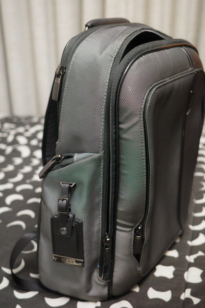 TUMI Arrive Larson Backpack (Silver) (Category: Backpacks) located in Taytay. Submitted by julesantenor (Listing ID 1461879408, Image 2). Description: This backpack was barely used. Only issue is that the monogram patch already has an engraving. You can buy replacement patches online so it should be an easy fix. Makati Location..