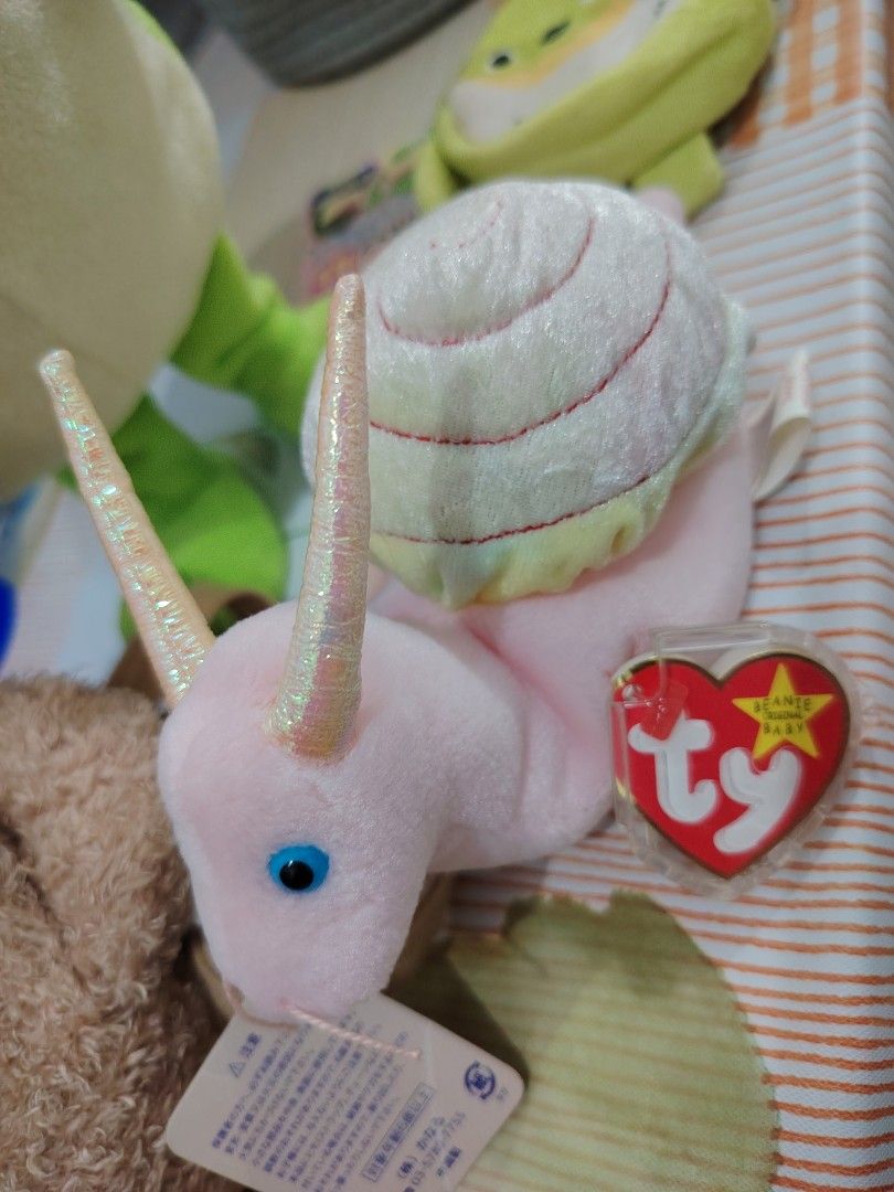 Ty Beanie Baby SWIRLY (Category: Plushies & Soft Toys) located in Pasay City. Submitted by jboxshop (Listing ID 1461968948, Image 1). Description: - Adorable pink snail Beanie Baby - Shell boasts charming pastel rainbow stripes - Comes with the original Ty tag - Ideal for Beanie Baby collectors .