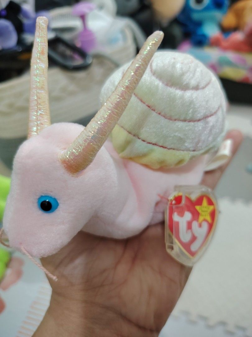Ty Beanie Baby SWIRLY (Category: Plushies & Soft Toys) located in Pasay City. Submitted by jboxshop (Listing ID 1461968948, Image 2). Description: - Adorable pink snail Beanie Baby - Shell boasts charming pastel rainbow stripes - Comes with the original Ty tag - Ideal for Beanie Baby collectors .